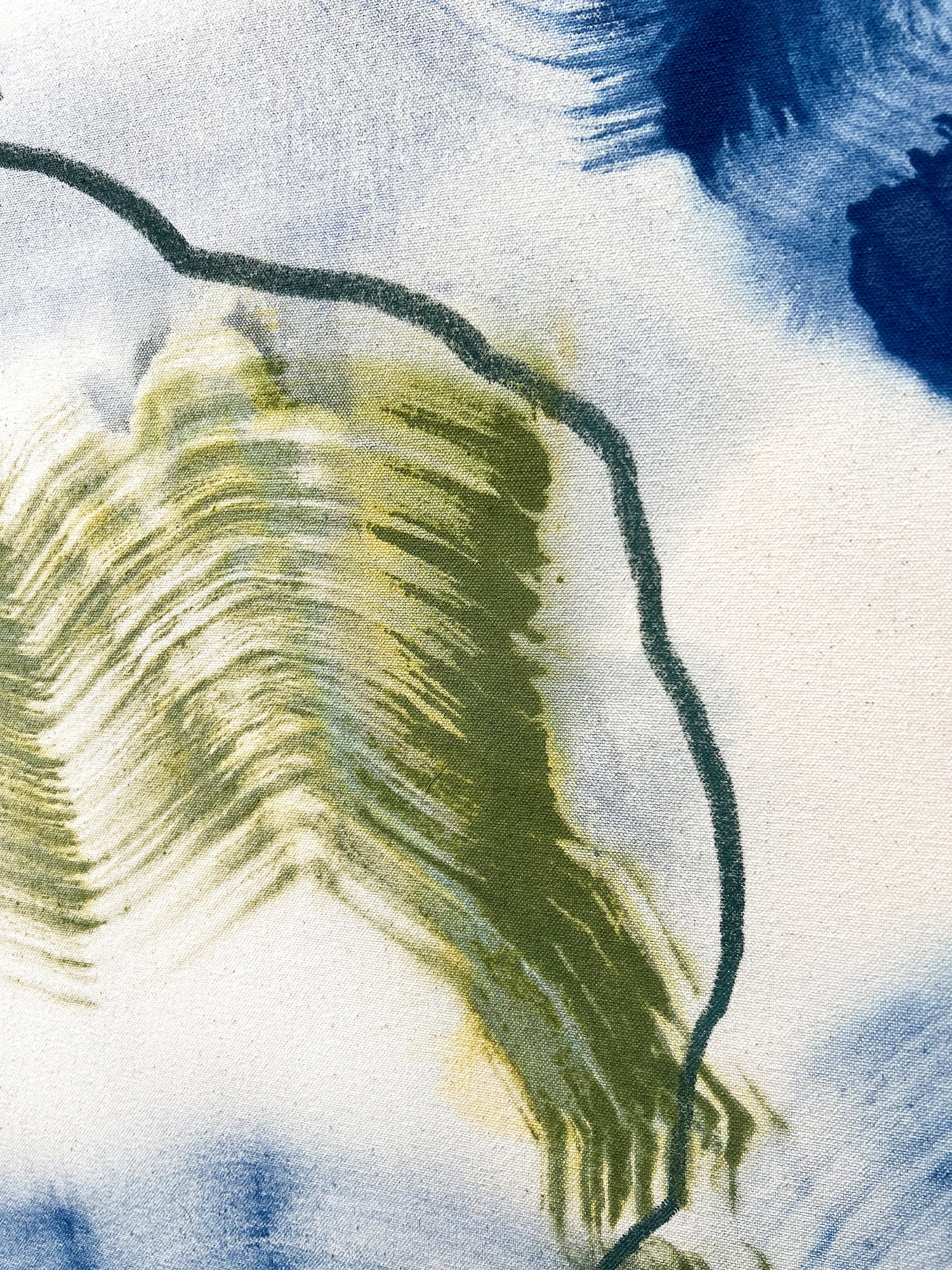 Close-up showing expressive mark-making in soft abstract tones.